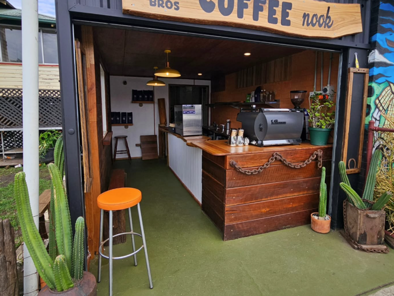 A cafe coffee nook with a timber counter and timber lined ceiling